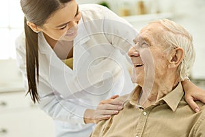 Trusted medical personnel acting supportive towards senior patient