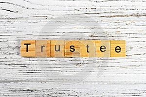 Trustee word made with wooden blocks concept photo