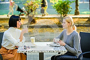 Trustful communication. Friendship sisters. Friendship meeting. Female leisure. Girls friends drink coffee talk