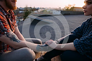 Trustful relationships. Romantic date on roof photo