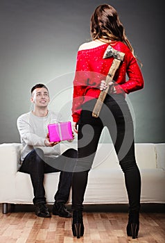 Trusting guy giving present to misleading girl