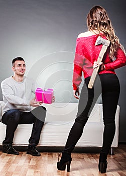 Trusting guy giving present to misleading girl