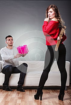 Trusting guy giving present to misleading girl