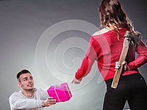 Trusting guy giving present to misleading girl