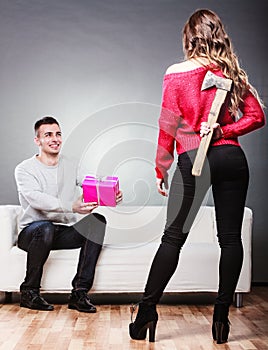 Trusting guy giving present to misleading girl