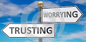 Trusting and worrying as different choices in life - pictured as words Trusting, worrying on road signs pointing at opposite ways