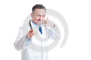 Trustworthy and confident doctor making contact us gesture photo