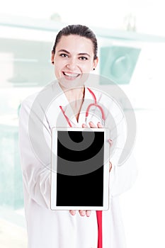 Trustworthy medical specialist holding modern tablet