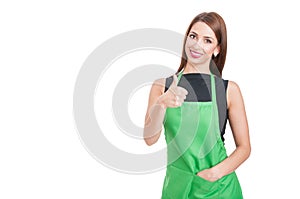 Trustworthy saleswoman doing like gesture