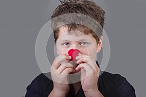 Truth - boy with red clown nose