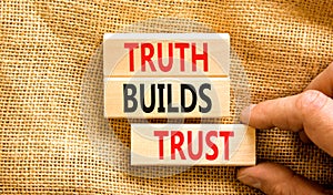 Truth builds trust symbol. Concept words Truth builds trust on wooden blocks on a beautiful canvas table canvas background.