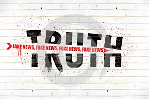 Truth destroyed with an arrow of fake news painted on old white wall