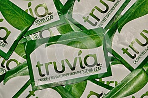 Truvia packets scattered loosely, full frame macro image.