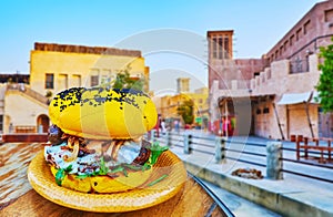 Try the camel burger in restaurant of Al Fahidi, Dubai, UAE