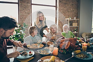 Try my bread mom. Photo of big family gathering sit feast dishes dinner table wife giving everybody fresh bakery multi