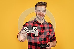 try this one. man playing video game with controller. bearded man using virtual reality gamepad. new videogame online