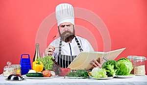 Try something new. Cookery on my mind. Cooking skill. Book recipes. According to recipe. Man bearded chef cooking food