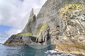 Trøllkonufingur - imposing rock pillar of Sandavágur.