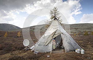 Tsaatan boy at the door of his home yurt