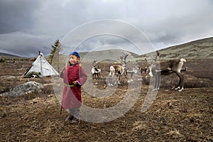Tsaatan kid in a taiga of northern Mongolia photo