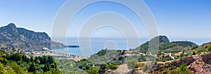 Tsambika Beach in a closed bay. Famous place for beach leisure and multifarious water attraction. Vacation on Greece islands in