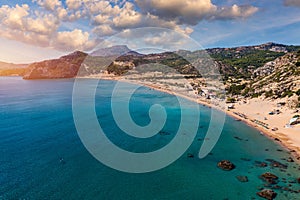 Tsampika beach with golden sand view from above, Rhodes, Greece. Aerial birds eye view of famous beach of Tsampika, Rhodes island