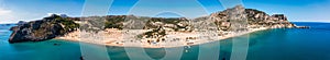 Tsampika beach with golden sand view from above, Rhodes, Greece. Aerial birds eye view of famous beach of Tsampika, Rhodes island