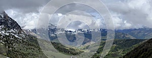 Tseylomsky pass in Ingushetia. A trip uphill to the Tsei Loam pass on a cloudy spring day. Panorama of the high cliffs photo