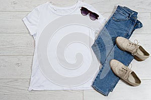 Tshirt t-shirt t shirt mock up top view on wooden floor, clothes background copy space shirt flatlay