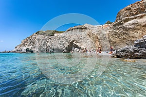 Tsigrado beach, crystal clear water in Milos Island, Greece photo