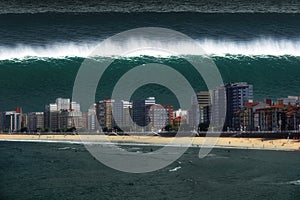 Tsunami breaking on city coast