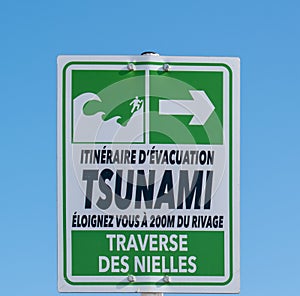 Tsunami evacuation sign on the beach of Antibes near Nice (Cote d\'Azur, France)