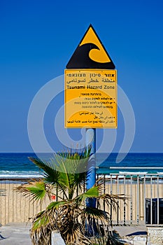 Tsunami hazard zone sign near the Mediterranean sea beach