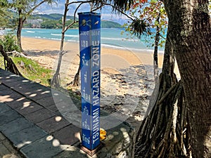Tsunami hazard zone signs near the beach.