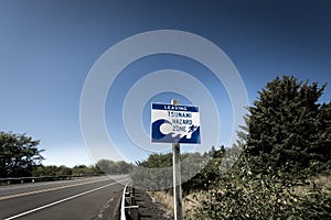 A tsunami warning sign along a coastal highway near the Oregon coast.