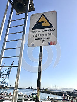 Tsunami zone sign by a ladder