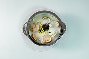 tteok mandu guk, Korean style dumpling soup with sliced rice cake