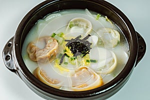 tteok mandu guk, Korean style dumpling soup with sliced rice cake