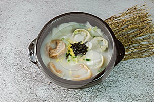 tteok mandu guk, Korean style dumpling soup with sliced rice cake