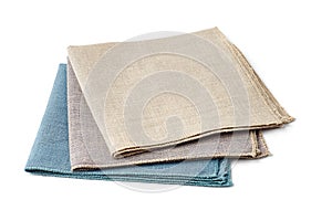 Tthree colorful textile napkins on white background