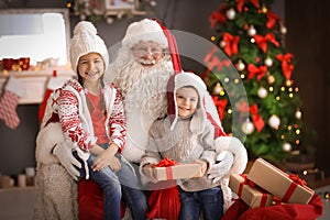 Little children and authentic Santa Claus