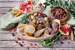 Tu Bishvat holiday symbols - dried fruits, pomegranate, barley, wheat