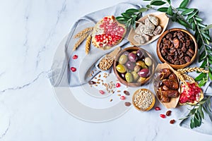 Tu Bishvat holiday symbols - dried fruits, pomegranate, barley, wheat