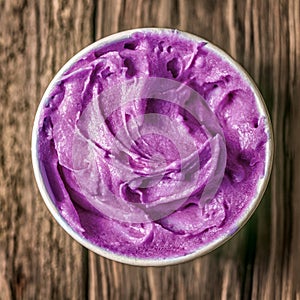 Tub of colorful purple berry ice cream