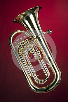 Tuba Bass Euphonium Isolated on Red photo