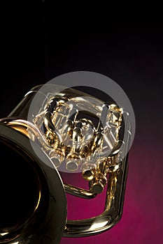 Tuba Euphonium Isolated on Red photo