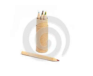 Tube with colored pencils and cover on white