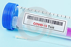 Tube containing nasopharyngeal swab for coronavirus or COVID-19 test photo