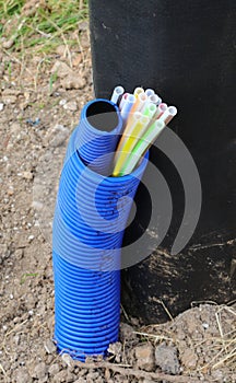 tube containing small colored tubes for laying optical fibers to