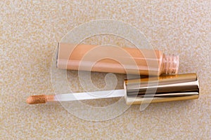 Tube of flawless wear creamy concealer with doe-foot applicator, high cover to conceal spots, blemishes photo
